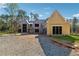 New home features large windows, and a spacious driveway is currently under construction at 225 Maison Court, Roswell, GA 30076