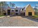 New home features large windows, and a spacious driveway is currently under construction at 225 Maison Court, Roswell, GA 30076