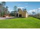 New home construction featuring a spacious lawn, ideal for outdoor activities and landscaping at 225 Maison Court, Roswell, GA 30076