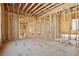 Open floor plan shows exposed framing, plumbing, and electrical components of in-progress construction at 225 Maison Court, Roswell, GA 30076