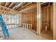 Room during framing, showing plumbing and electrical with a bright window, revealing the construction process at 225 Maison Court, Roswell, GA 30076