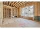 Framing with window placement shows bright and airy living space ready for customization during construction at 225 Maison Court, Roswell, GA 30076