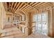 Hallway featuring exposed beams, natural light, and wood studs at 225 Maison Court, Roswell, GA 30076