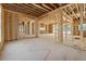 Spacious, unfinished living room with large windows and open layout in new construction home at 225 Maison Court, Roswell, GA 30076