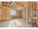 New room featuring exposed beams, natural light, and wood studs at 225 Maison Court, Roswell, GA 30076