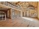 Exposed framing shows large open space and high ceilings for a grand living area during construction at 225 Maison Court, Roswell, GA 30076