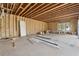 Unfinished room featuring exposed framing, a new door, and ample space for customization at 225 Maison Court, Roswell, GA 30076
