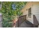 Charming home back porch with a wooden deck and lush greenery at 4535 Forest Green Dr, Sugar Hill, GA 30518