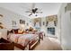 Charming bedroom with twin beds, ceiling fan, and bright windows at 4535 Forest Green Dr, Sugar Hill, GA 30518