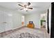 This Bedroom features two doors, one to a bath and one to the hallway, and a ceiling fan at 4535 Forest Green Dr, Sugar Hill, GA 30518