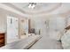 Comfortable bedroom features a ceiling fan, a doorway to the bath, and a closet at 4535 Forest Green Dr, Sugar Hill, GA 30518