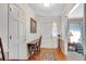 Welcoming foyer with hardwood floors, leading to various rooms and featuring neutral wall colors at 4535 Forest Green Dr, Sugar Hill, GA 30518
