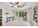 Room with bay windows with bench, desk and lamp, ceiling fan, and a cat tree at 4535 Forest Green Dr, Sugar Hill, GA 30518