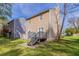 Backyard features a wooden deck, mature trees, and a spacious yard at 2030 Hilda Burns Pl, Lithonia, GA 30058