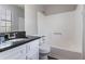 This full bath features a large mirror, a granite countertop, and a shower/tub combination at 2030 Hilda Burns Pl, Lithonia, GA 30058
