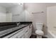 This bathroom features a granite countertop and a shower/tub combination at 2030 Hilda Burns Pl, Lithonia, GA 30058