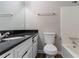 This bathroom features a granite countertop and a shower/tub combination at 2030 Hilda Burns Pl, Lithonia, GA 30058