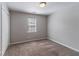 Bedroom with neutral carpet, light gray walls, and a double-door closet at 2030 Hilda Burns Pl, Lithonia, GA 30058