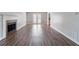 Bright living room with hardwood floors, a fireplace, and a door to the back at 2030 Hilda Burns Pl, Lithonia, GA 30058