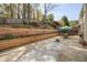 Large patio with a dining area, creating a perfect space for outdoor gatherings and enjoying the backyard at 2835 Olde Town Park Dr, Norcross, GA 30071