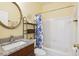 This bathroom has a vanity, sink, toilet, tub and shower with blue and white patterned curtain at 2835 Olde Town Park Dr, Norcross, GA 30071