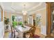 Dining room with chandelier, large window, and elegant table setting at 2835 Olde Town Park Dr, Norcross, GA 30071