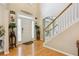 Inviting foyer with hardwood floors, staircase, and stylish decor at 2835 Olde Town Park Dr, Norcross, GA 30071