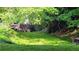 This home is near a green space featuring a historic stone bridge, adding charm and natural beauty at 2835 Olde Town Park Dr, Norcross, GA 30071
