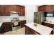 Modern kitchen with stainless steel appliances, a kitchen island, and beautiful countertops at 2835 Olde Town Park Dr, Norcross, GA 30071