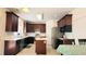 Kitchen with stainless appliances and island, adjacent to breakfast table at 2835 Olde Town Park Dr, Norcross, GA 30071