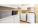 Functional laundry room with modern appliances and storage space for convenient laundry tasks at 2835 Olde Town Park Dr, Norcross, GA 30071