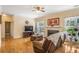 Comfortable living room boasts hardwood floors, a fireplace, and plenty of natural light at 2835 Olde Town Park Dr, Norcross, GA 30071