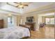 Large main bedroom with a tray ceiling and a sitting area with large windows at 2835 Olde Town Park Dr, Norcross, GA 30071