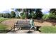 Bench with a statue in Thrasher Park in Norcross, GA at 2835 Olde Town Park Dr, Norcross, GA 30071
