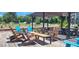 Outdoor patio area with colorful chairs and modern furniture at 2835 Olde Town Park Dr, Norcross, GA 30071