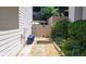 This home has a side yard featuring a stone pathway leading to a gate, adding charm and accessibility at 2835 Olde Town Park Dr, Norcross, GA 30071