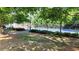 Play tennis on the community court, nestled among trees and landscaped grounds at 2835 Olde Town Park Dr, Norcross, GA 30071