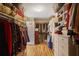 Spacious walk-in closet with custom shelving and ample storage space for clothing and accessories at 2835 Olde Town Park Dr, Norcross, GA 30071