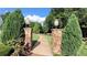 Scenic pathway with stone pillars and lush greenery at Thrasher Park in Norcross, GA at 2835 Olde Town Park Dr, Norcross, GA 30071