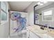 Bathroom with a stylish shower curtain, vanity with marble countertop, and gray patterned floor at 6909 Heritage Pl, Acworth, GA 30102