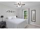 Well-lit bedroom with moon decor, comfortable queen bed, window, and carpeting at 6909 Heritage Pl, Acworth, GA 30102