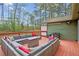 Spacious outdoor deck featuring comfortable furniture, a built-in grill, and scenic backyard views at 6909 Heritage Pl, Acworth, GA 30102