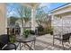 Relaxing balcony area with outdoor seating and a view of the surrounding neighborhood and lush trees at 865 Inman Village Ne Pkwy, Atlanta, GA 30307