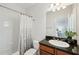 Bathroom featuring tiled shower and bath combo with a granite-topped vanity at 865 Inman Village Ne Pkwy, Atlanta, GA 30307