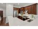 Gourmet kitchen with stainless steel appliances, dark wood cabinets, and white quartz countertops at 865 Inman Village Ne Pkwy, Atlanta, GA 30307