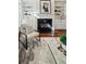 Stylish living room features a cozy fireplace, built-in shelving, and a comfortable chair at 865 Inman Village Ne Pkwy, Atlanta, GA 30307