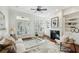 Cozy living room with a fireplace, built-in bookshelves, and French doors leading to the outdoor deck at 865 Inman Village Ne Pkwy, Atlanta, GA 30307