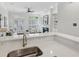 Bright open-concept living area with kitchen, fireplace, built-in shelves and french doors at 865 Inman Village Ne Pkwy, Atlanta, GA 30307