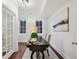 Bright office with dark wood floors, unique desk, and white trim at 865 Inman Village Ne Pkwy, Atlanta, GA 30307