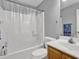 Bathroom featuring a shower/tub combo, with a white shower curtain, and a single-sink vanity at 240 Springbottom Ct, Lawrenceville, GA 30046